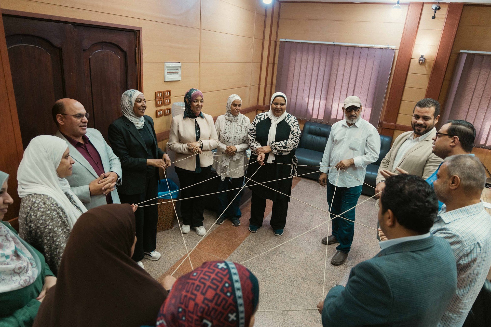 She Builds Peace Egypt workshop participants in the Web of Life activity